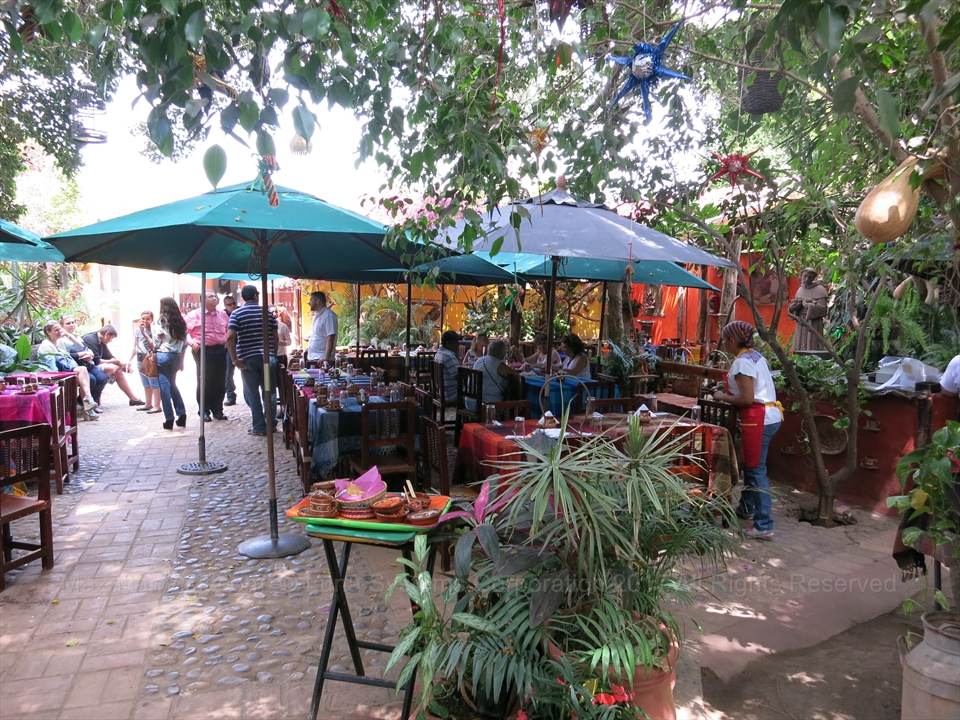 Colorful paper decorations strung across the open air central courtyard