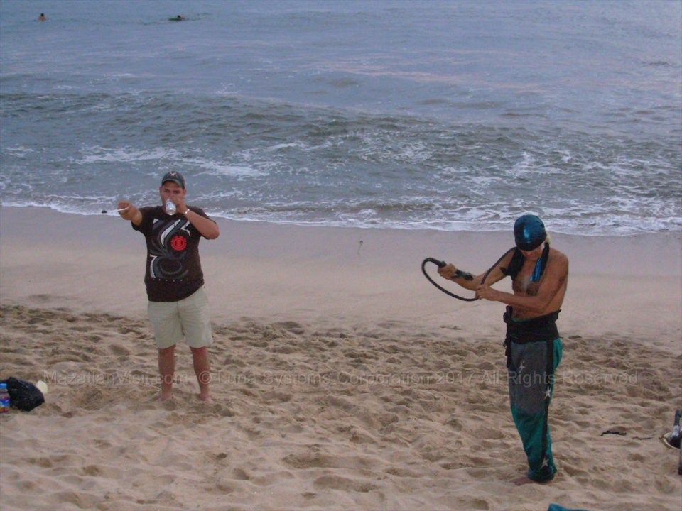 Jose showcasing his physical balance and strength to the beach crowd