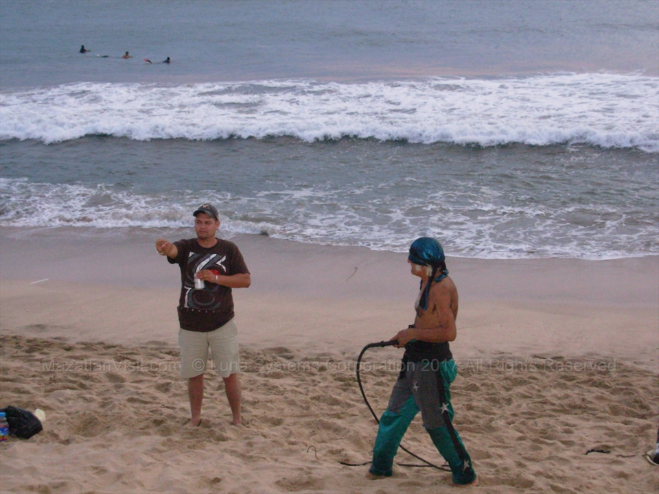 Jose collecting tips and donations from tourists after his performance