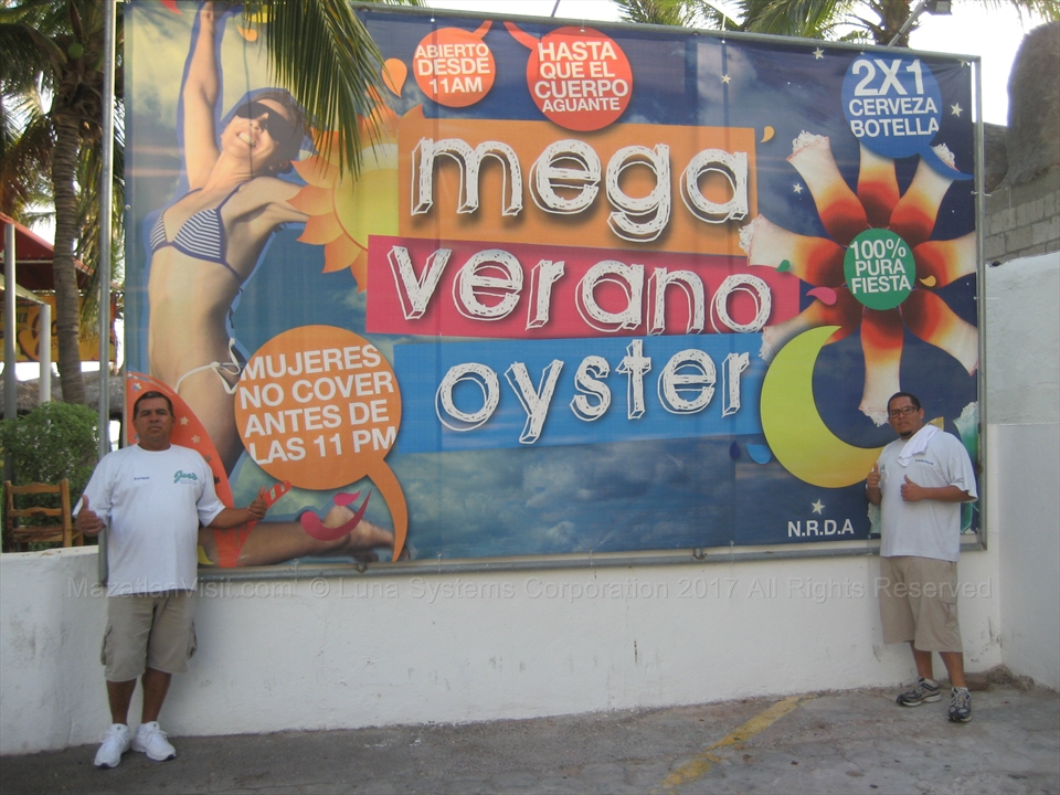 Lively bar atmosphere displaying promo drink signs in Mazatlán