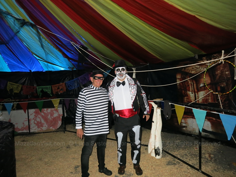 Packed crowd enjoying Halloween night on the beach in Mazatlán