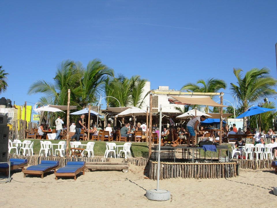 Couples dancing to live music beachfront in Mazatlán, Mexico