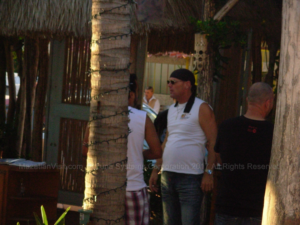 Brent McAthey close up portrait greeting fans at a seaside table layout