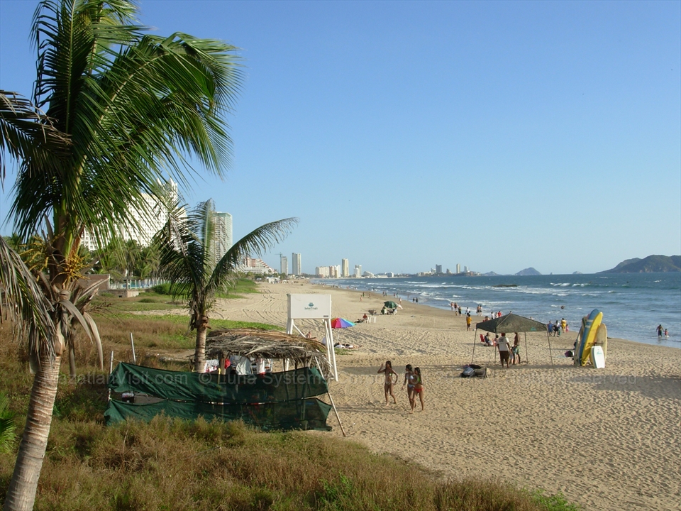 Wide open surf sands of Playa Bruja near the northern point