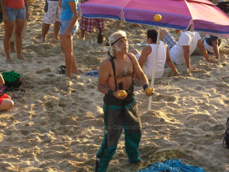 Jose the Martial Artist performing a balanced physical stunt on the beach in Mazatlán