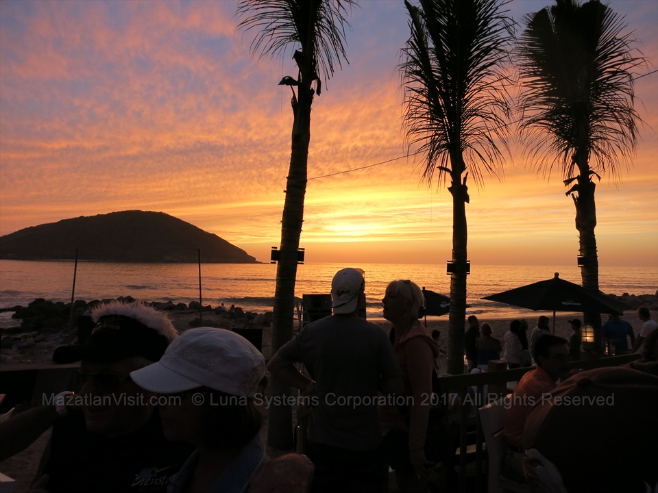 A busy Tuesday afternoon crowd enjoying the live music and ocean breezes