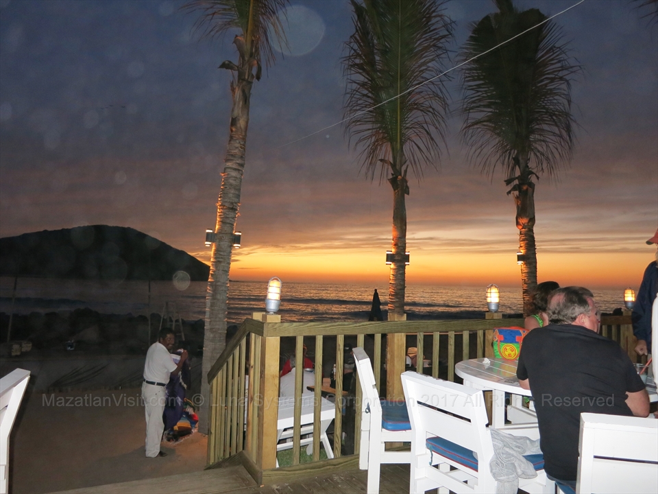 Beautiful golden sunset framing the final hours of the weekly Tuesday bash