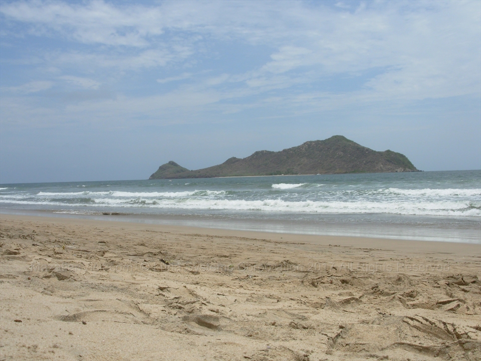 Resort towers lining the wide flat sands of Playa Gaviotas sector