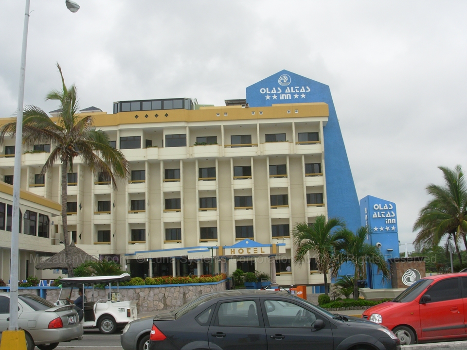 The front main entrance signage of Olas Altas Inn along the boardwalk