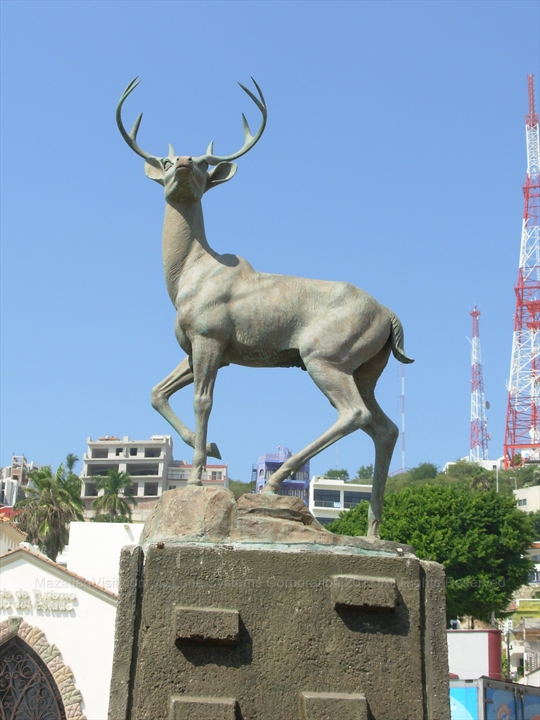 Bronze deer monument sculpture looking out over the water at Olas Altas