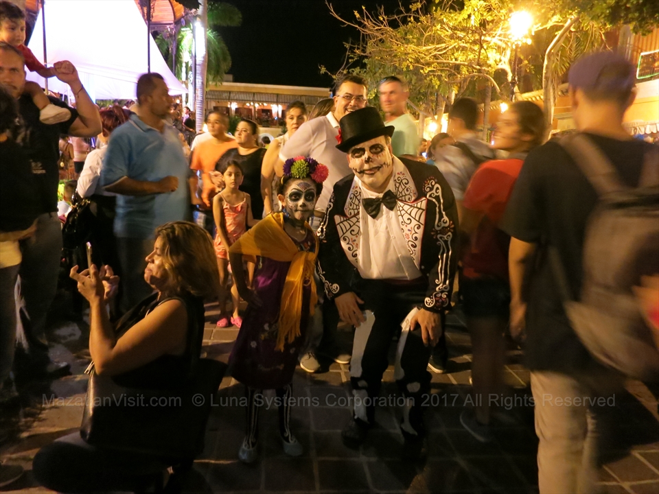 Day of the Dead parade costumes and altars inside Mazatlán