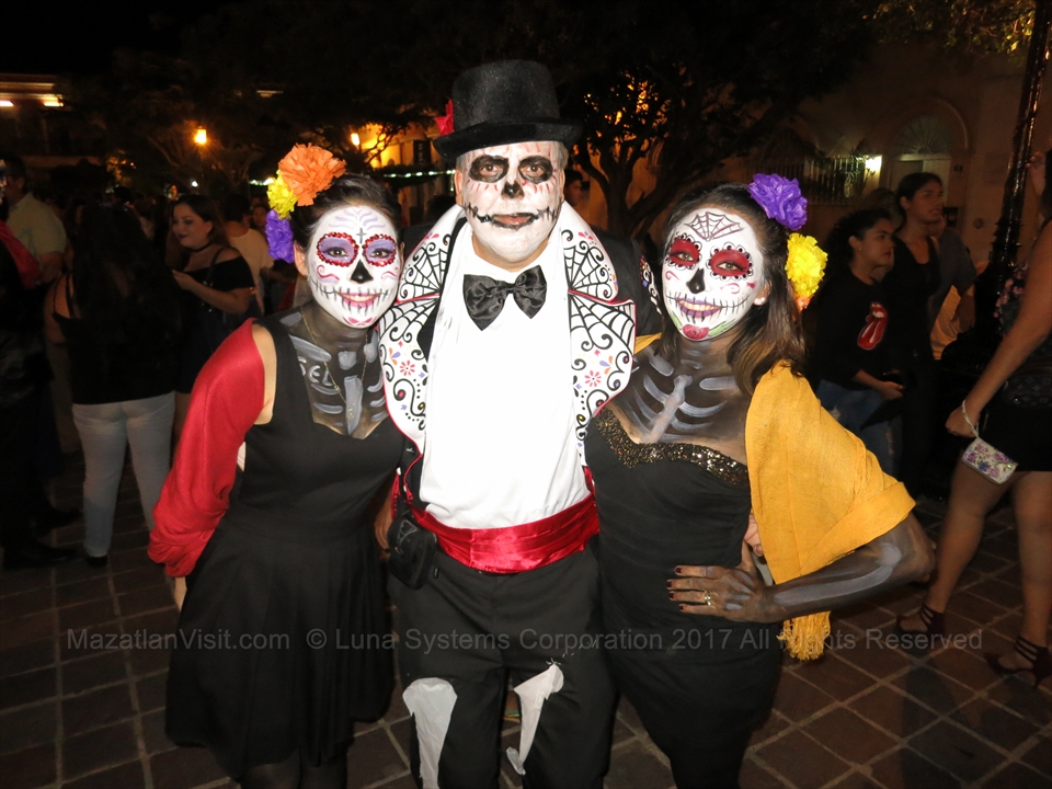 Catrina face paint and skull altars for Day of the Dead in Centro Historico