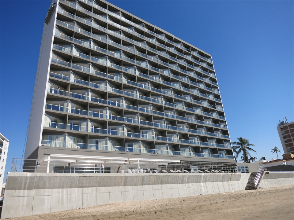 The modern exterior tower of the Holiday Inn Resort located on the beach in Mazatlán
