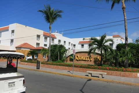 The exterior storefront entrance of Quality Inn inside the Golden Zone