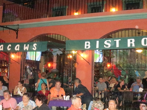 The indoor stage and seating tables inside Macaws lounge restaurant