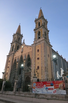 The front golden towers of the Cathedral Basilica de la Inmaculada Concepción in Mazatlán, Mexico
