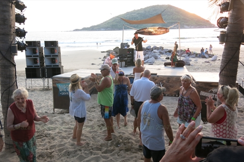 Canadian singer Brent McAthey performing for a large dancing crowd at Brenster's Beach Bash