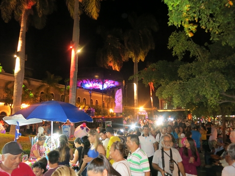 Day of the Dead parade procession floats moving past spectators in Mazatlán