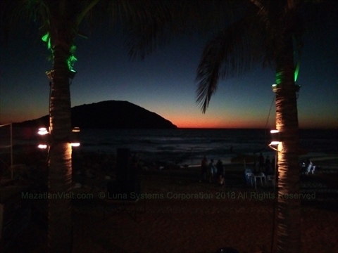 Spectacular fiery orange sunset over the ocean viewed from Diego's dining deck