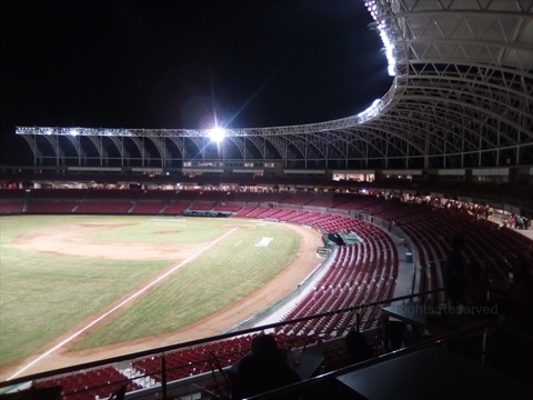 Packed stadium seats cheering during a home game