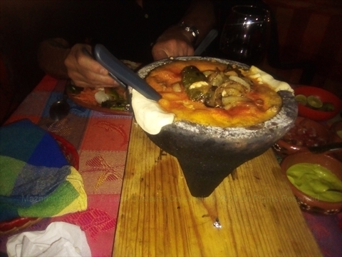 A sizzling volcanic stone molcajete stew served at Las Brochetas restaurant