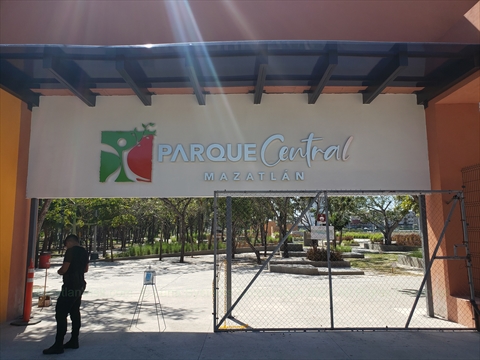 The modern grand white structural gateway canopy at the main entrance plaza