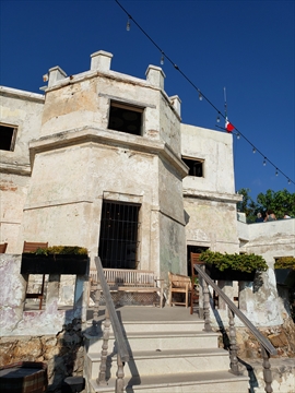The historical masonry stonework framing the main building entry doors