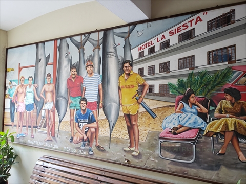 Intricate painted wall murals inside the courtyard