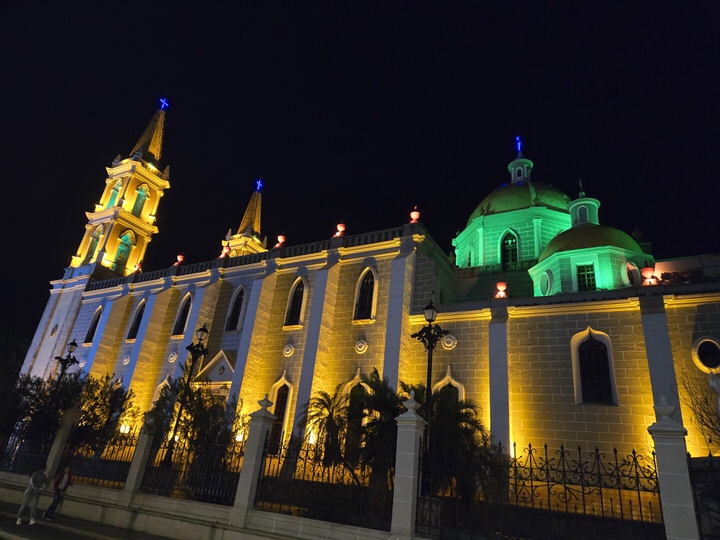 Side perspective tracing the glowing arches of the cathedral exterior stonework