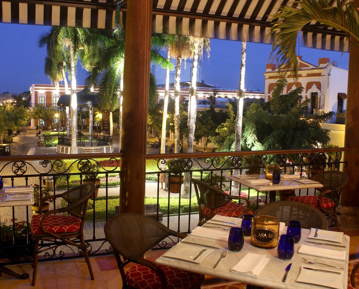 The upscale historical second floor dining veranda of Casa 46 overlooking the central park square