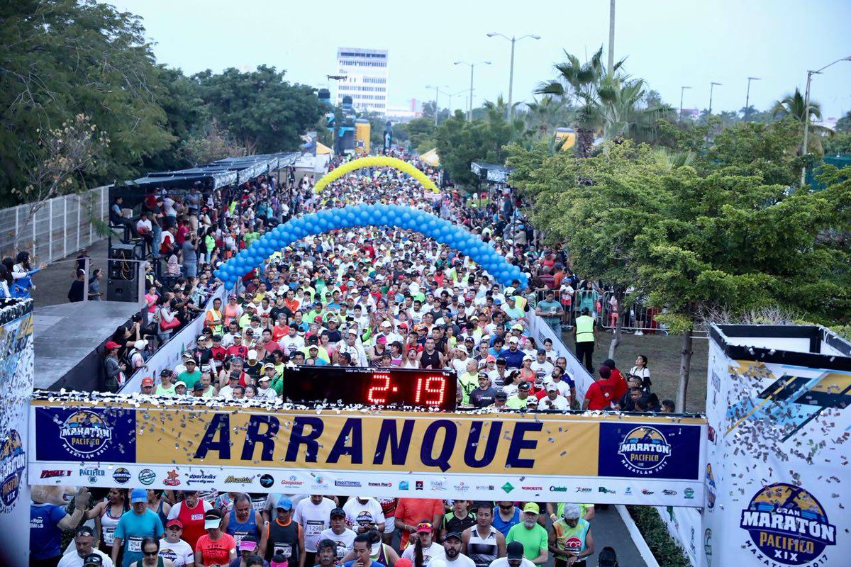 Marathon runners traveling along the scenic coastal seawall route in Mazatlán, Mexico