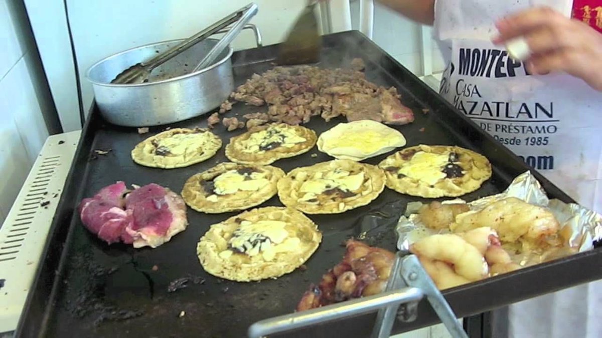 Traditional Mexican street taco food stand operation in Mazatlán