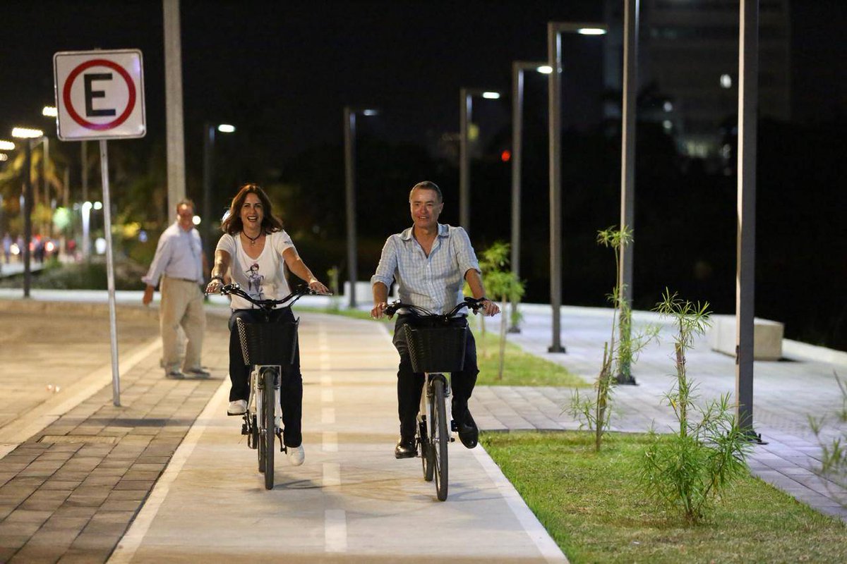 A wide concrete bicycle lane path tracing alongside the beachfront seawall boulevard
