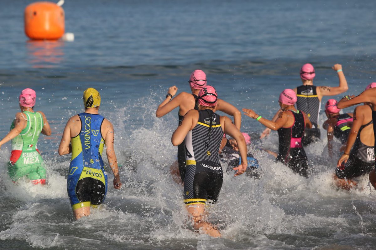 Athletes swimming and transition racing at the Mazatlán International Triathlon