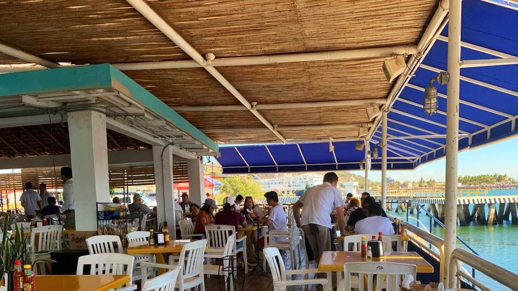 The open air seaside dining deck at La Puntilla restaurant near the cruise port