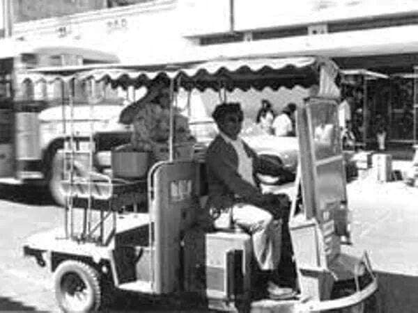 Vintage archival photo of an original 1960s three-wheeled Cushman Pulmonia in Mazatlán