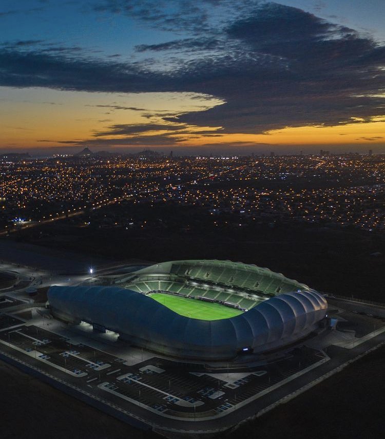 Wide view tracking across the grandstands of the newly constructed Mazatlán stadium complex