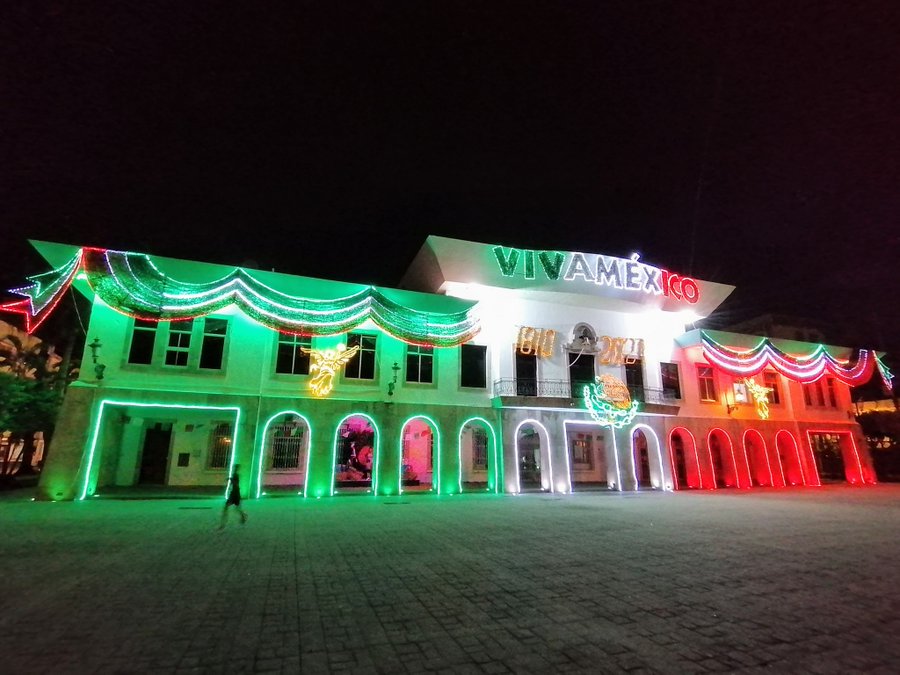 The municipal palace hall illuminated with decorative national flags