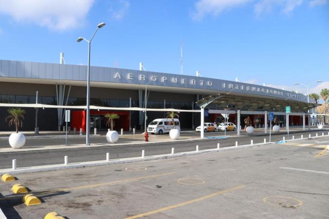Airplanes parked along the tarmac gates at MZT international airport