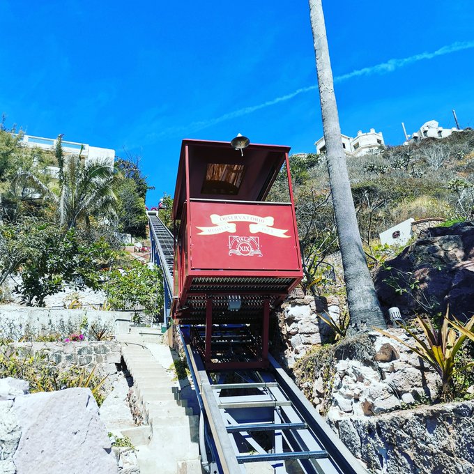The open air funicular train car scaling the steep tracks of Cerro del Vigia hill