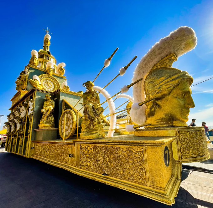 A sophisticated artistic float structure housing folk musicians performing during parade cycles