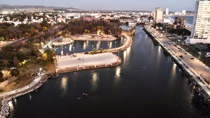 Scenic walking trails wrapping around the wide urban lagoon layout at Central Park in Mazatlán