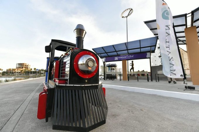 Children boarding the recreational tractor train ride in Mazatlan Central Park