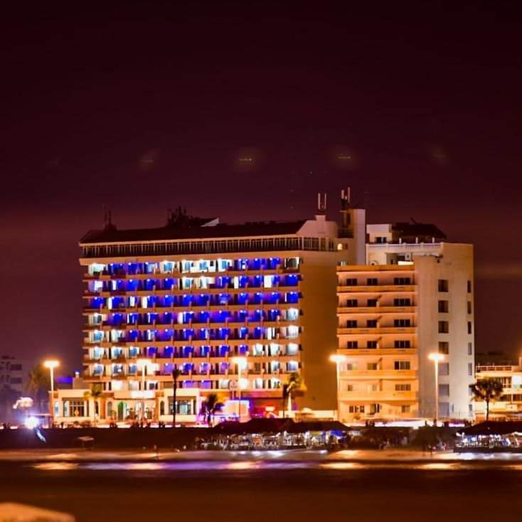 The front main facade of Hotel Hacienda facing the Malecón seawall