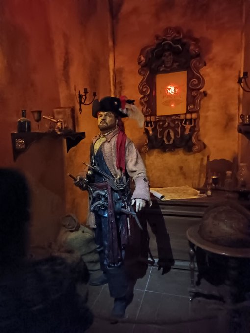 Recreations of historic wooden pirate ships and chests on display