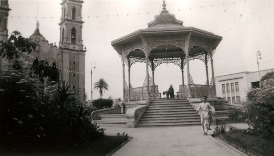 Vintage monochrome archival photograph of early horse drawn transit at Plaza República
