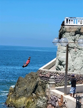 Cliff Diver jumping into the ocean in Mazatlán, Sinaloa, Mexico