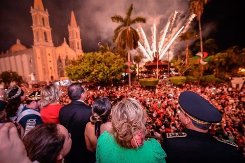 Crowd celebrating Independence Day outside city hall in historic downtown Mazatlán, Mexico