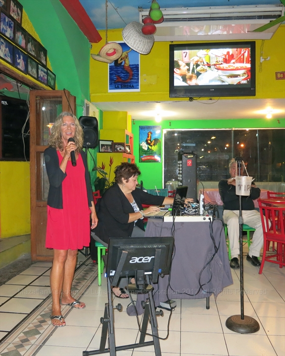 Singers enjoying a fun night at a local karaoke bar